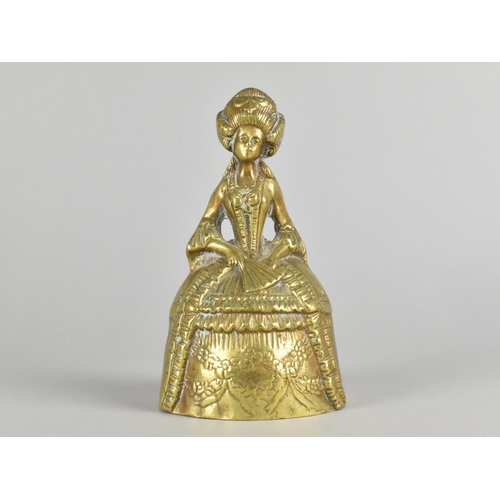 34 - A Heavy Brass Figural Table Bell in the Form of a Crinoline lady, 16cm High