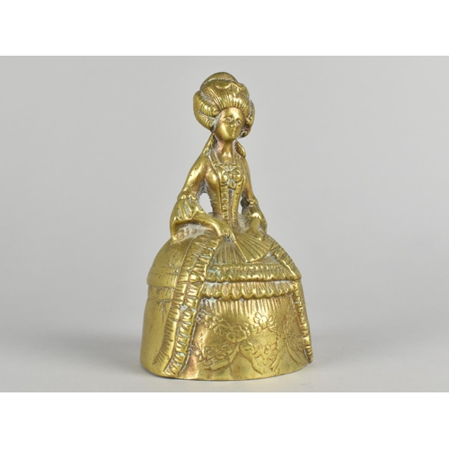 34 - A Heavy Brass Figural Table Bell in the Form of a Crinoline lady, 16cm High