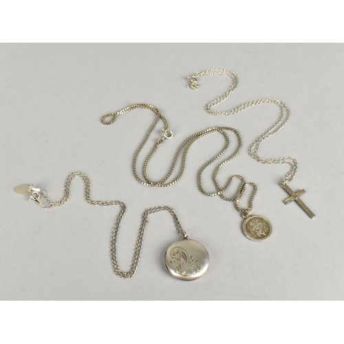 410 - Three Silver Chains with Silver Pendants to include Locket, Cross and St. Christopher (Chain Lengths... 