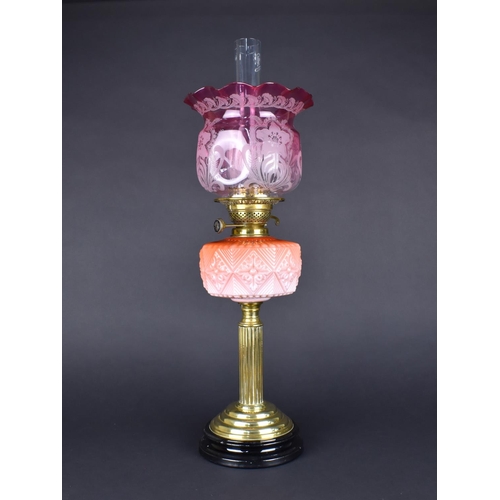 47 - A Late Victorian Brass Oil Lamp, with Opaque Pink Glass Reservoir, And Etched Cranberry Shade, Suppo... 