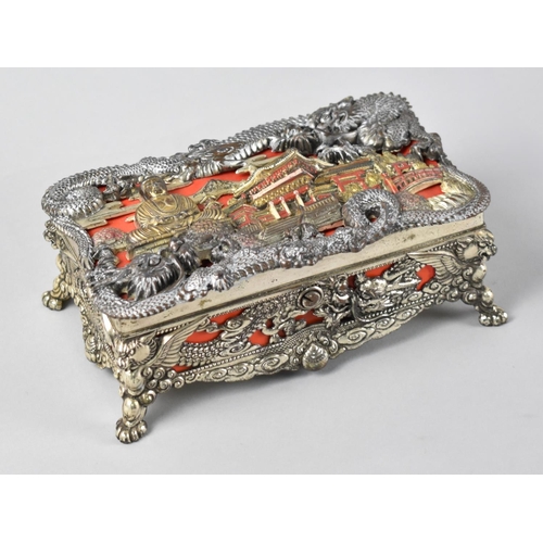 50 - A Mid 20th Century Oriental Musical Box, the Lid and Sides Decorated in Heavy Relief with Palace, Bu... 