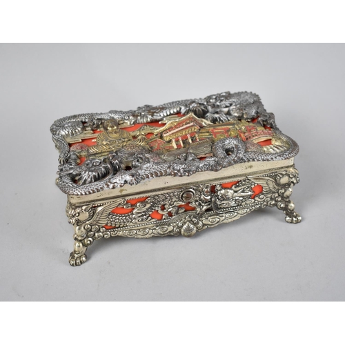 50 - A Mid 20th Century Oriental Musical Box, the Lid and Sides Decorated in Heavy Relief with Palace, Bu... 