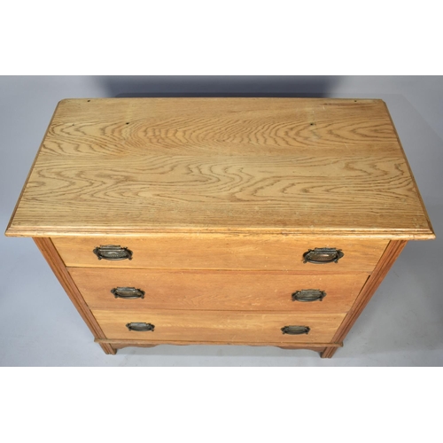 502 - An Edwardian Oak Three Drawer Bedroom Chest, 91cm wide