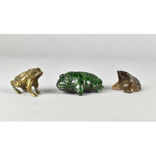 52 - A Collection of Three Small Frogs, in Bronze, Smokey Quartz and Green Flecked Marble