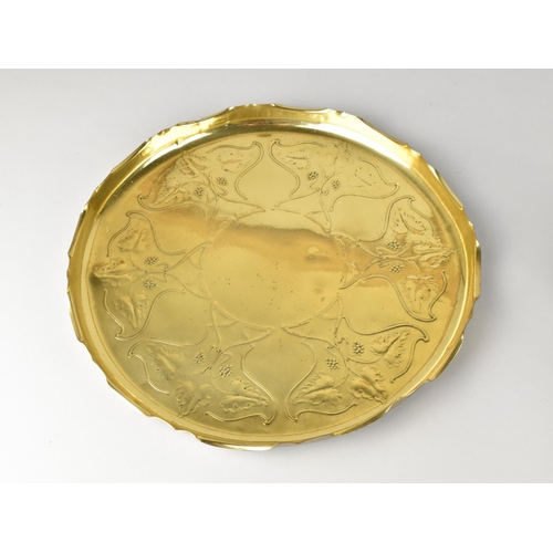 119 - An Art Nouveau Style Brass Circular Wall Hanging Decorated with Vine Leaves and Grapes, 31cms Diamet... 