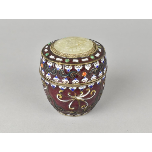 12 - A Chinese Enamelled White Metal Lidded Circular Pot with Pierced Jade Effect Disc to Lid, 7cms High