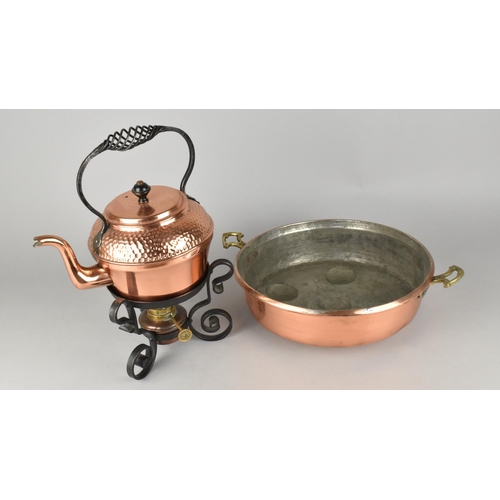 121 - An Arts and Crafts Copper Spirit Kettle with Burner together with a Circular Copper Pan