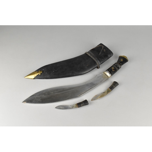 138 - A Vintage Kukri Knife and Two Dagger Set with Leather Scabbard