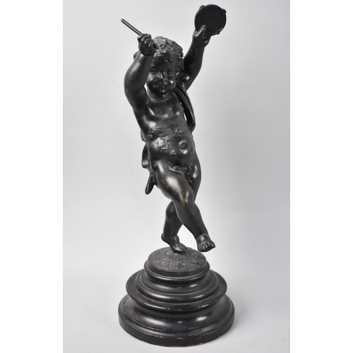 39 - A Patinated Spelter Figure of Cherub with Tambourine, 32.5cms High