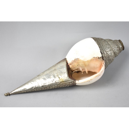 44 - A North Indian/Tibetan White Metal Mounted Conch Shell Temple Horn, 26cms Long