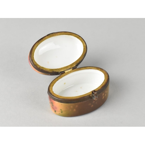 47 - A Continental Ormolu Mounted Oval Pill Box with Hinged Lid, 5cms Long