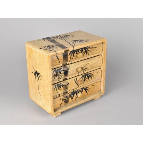 6 - A Modern Oriental Four Drawer Table Top Collectors Chest decorated with Bamboo, 16.5cms Wide and 16.... 