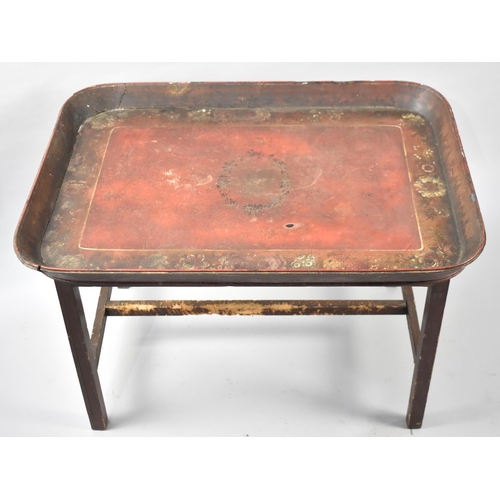 61 - A Large 19th Century Lacquered Tray Table with Floral Decoration to Inner Border, Base Somewhat Pet ... 