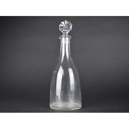 73 - A Hand Blown 19th Century Glass Decanter Bottle with Starburst Stopper, 23cms High