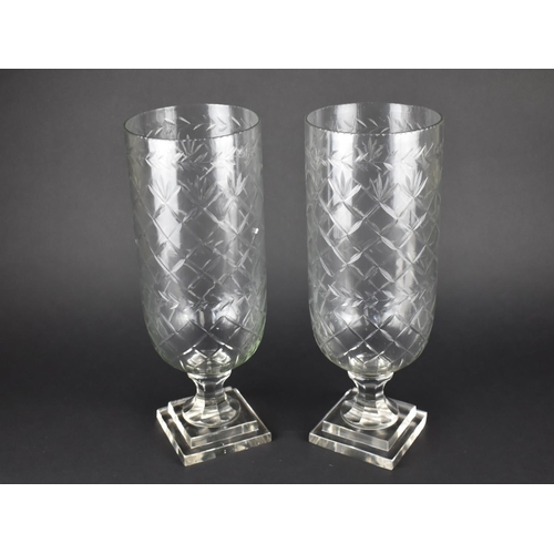 74 - A Pair of Tall Glass Hurricane Vases with Cut Decoration, 40cms High