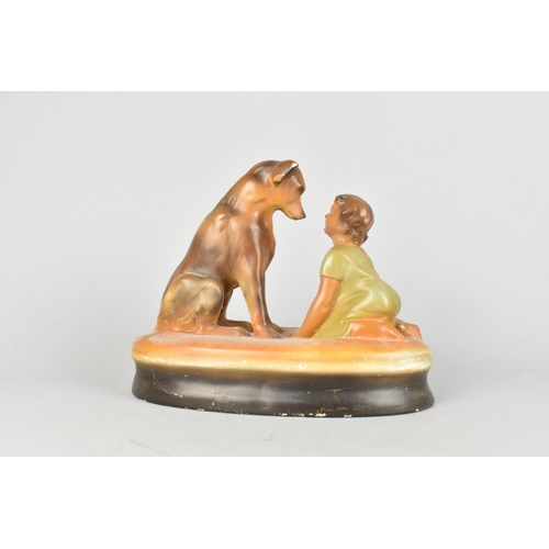 81 - An Early 20th Century Cold Painted Plaster Figure Group of Seated Dog and Young Child, 23cms Long