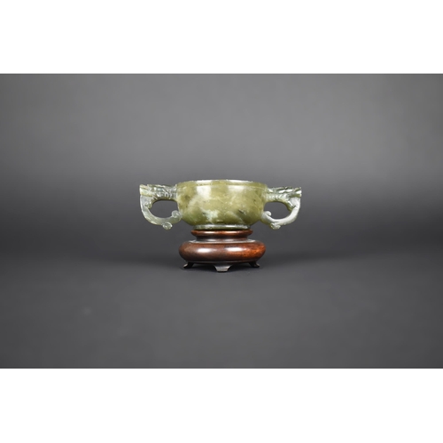 16 - A Chinese Spinach Jade Archaic Two Handled Cup, The Handles Carved in the Form of Dragon Masks, 12x3... 