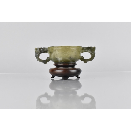 16 - A Chinese Spinach Jade Archaic Two Handled Cup, The Handles Carved in the Form of Dragon Masks, 12x3... 