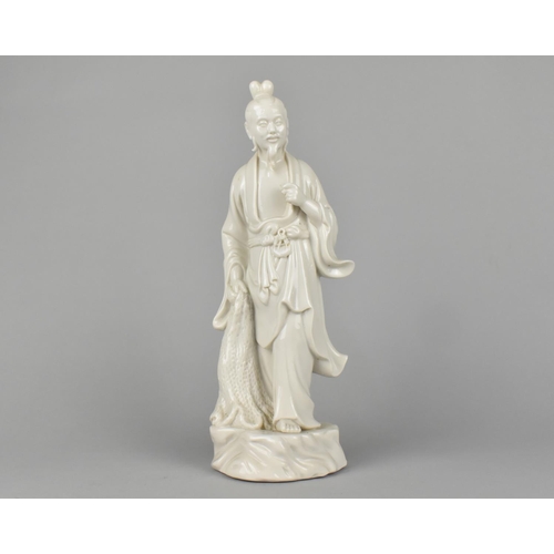 31 - A Chinese Porcelain Blanc de Chine Study of a Standing Fisherman with Net in Hand, 28cm (Missing Fin... 