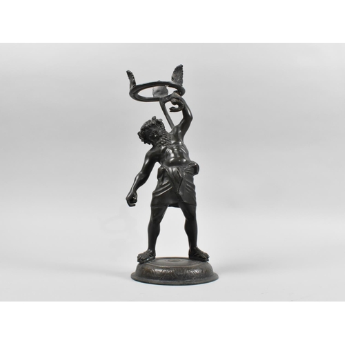 27 - A Patinated Bronze Stand in the Form of Atlas Holding Snake, 26cms High