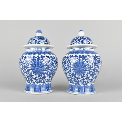 48 - A Pair of Modern Chinese Blue and White Lidded Vases of Baluster Form, Lotus Pattern, 18.5cms High