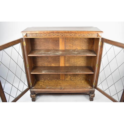 486 - A Mid 20th Century Oak Bookcase with Leaded Glazed Panelled Doors, 102cms Wide