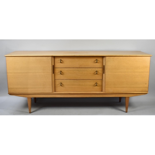 496 - A 1970s Sideboard with Three Centre Drawers Flanked by Cupboards, 185cms Wide