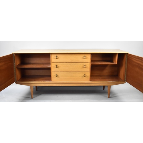 496 - A 1970s Sideboard with Three Centre Drawers Flanked by Cupboards, 185cms Wide