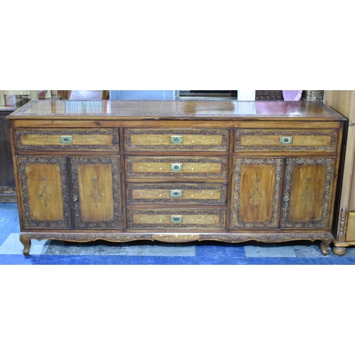 502 - A Far Eastern Carved and Brass Inlaid Hardwood Sideboard with Drawers and Cupboards, 182cms Wide