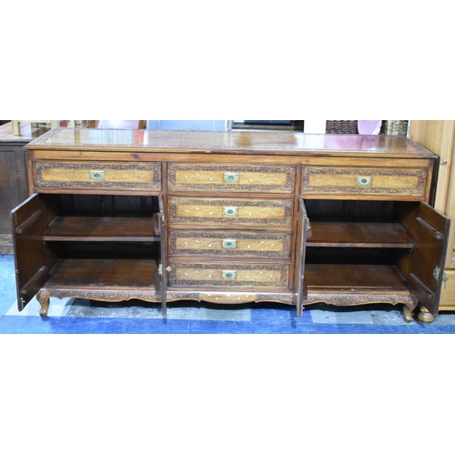 502 - A Far Eastern Carved and Brass Inlaid Hardwood Sideboard with Drawers and Cupboards, 182cms Wide