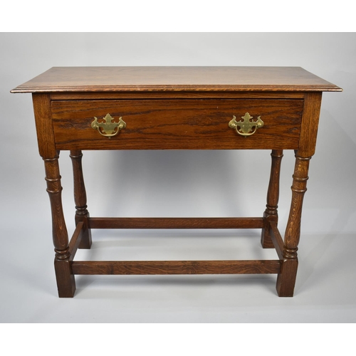 53 - A Late 20th Century Oak Side Table with Single Drawer, Turned Supports, 84cms Wide