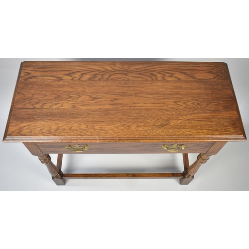 53 - A Late 20th Century Oak Side Table with Single Drawer, Turned Supports, 84cms Wide