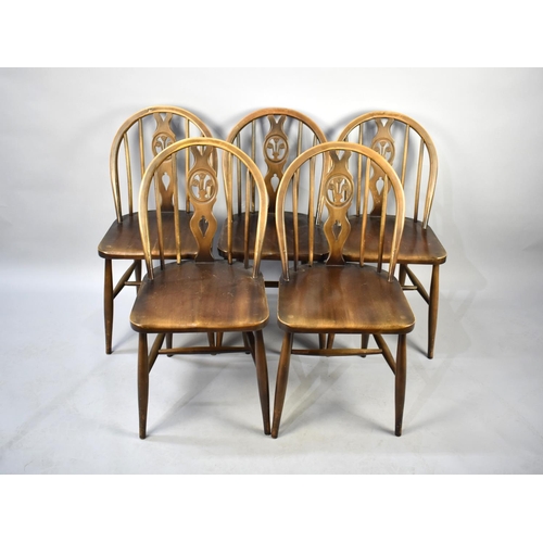 535 - A Set of Five Ercol Wheelback Fleur De Lys Chairs