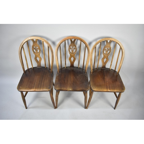 535 - A Set of Five Ercol Wheelback Fleur De Lys Chairs