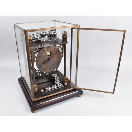 54 - A Late 20th Century Spherical Weight Clock with Twenty Chrome Balls which Travel on Feeding Rails, i... 