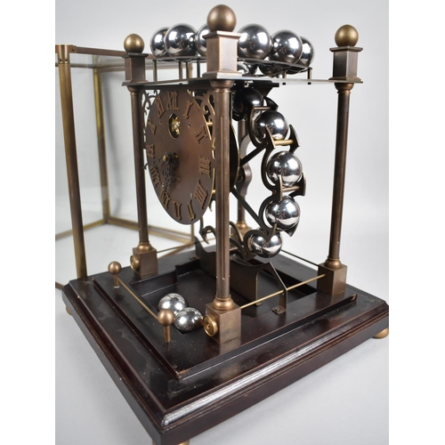 54 - A Late 20th Century Spherical Weight Clock with Twenty Chrome Balls which Travel on Feeding Rails, i... 