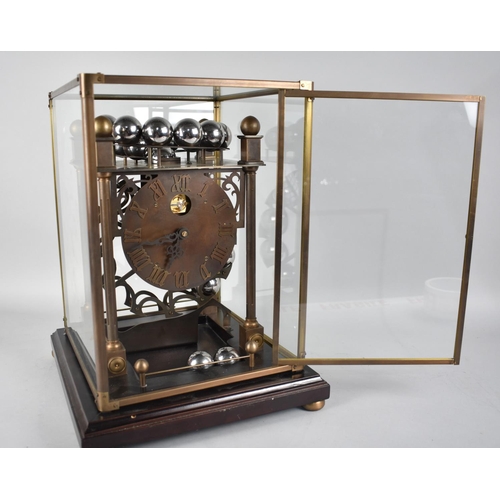 54 - A Late 20th Century Spherical Weight Clock with Twenty Chrome Balls which Travel on Feeding Rails, i... 