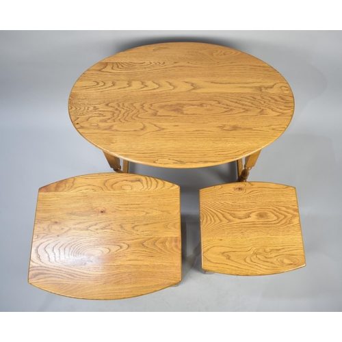 84 - A Modern Nest of Three Oval Topped Oak Tables, 82cms Wide