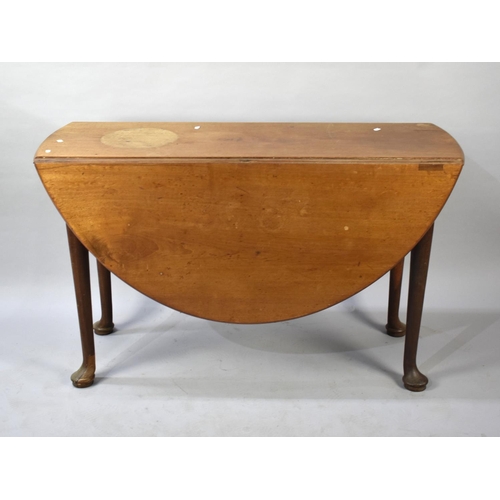 501 - A Mahogany Oval Topped Drop Leaf Dining Table, 121cms Wide