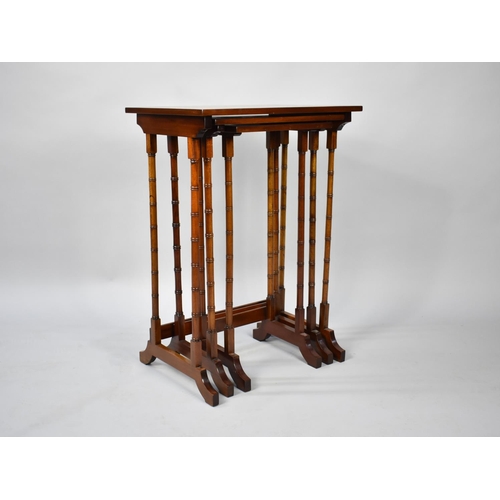 24 - A Reproduction Mahogany Nest of Three Tables with Spindle Supports, 50cm Wide