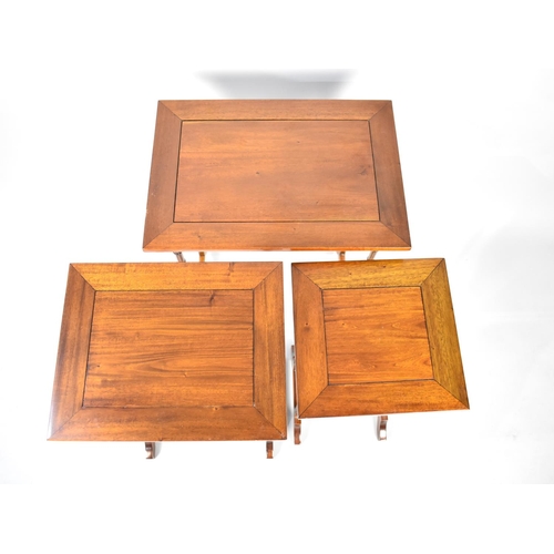 24 - A Reproduction Mahogany Nest of Three Tables with Spindle Supports, 50cm Wide