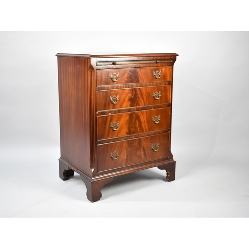 25 - A Small Reproduction Mahogany Chest of Four Graduated Drawers with Brushing Slide over, 63cm Wide an... 