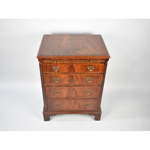 25 - A Small Reproduction Mahogany Chest of Four Graduated Drawers with Brushing Slide over, 63cm Wide an... 