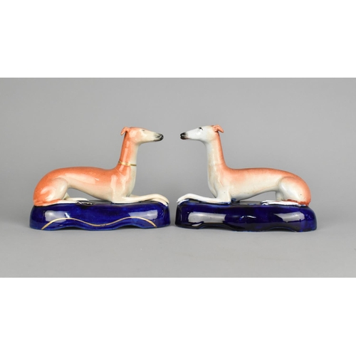 31 - A Pair of Staffordshire Reclining Greyhound Pen Holders, 17cm Long