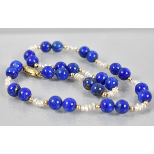 488 - A Lapis Lazuli and Pearl Necklace with Gilt Silver Clasp, 38cms Long