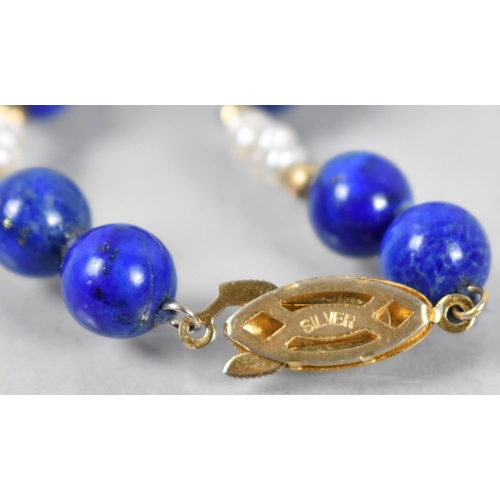 488 - A Lapis Lazuli and Pearl Necklace with Gilt Silver Clasp, 38cms Long