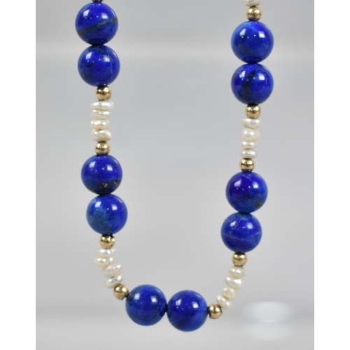 488 - A Lapis Lazuli and Pearl Necklace with Gilt Silver Clasp, 38cms Long