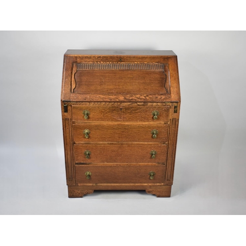 502 - A Mid 20th Century Oak Fall Front Bureau with Fitted Interior and Four Drawers to Base, 76cm wide