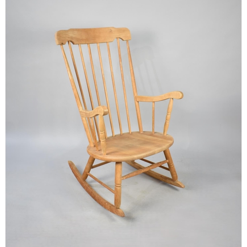 527 - A Late 20th Century Spindle Back Rocking Chair, Unpainted