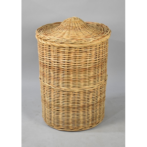 539 - A Large Cylindrical Wicker Clothes Basket Together with a Ceramic Table Lamp, 52cm Diameter